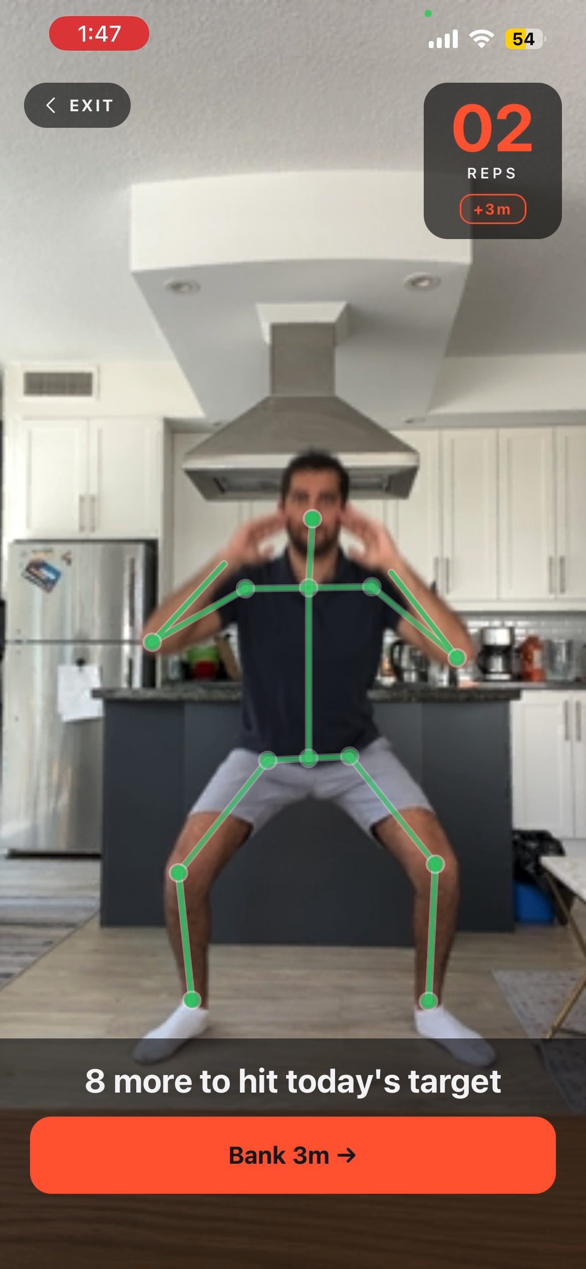 Live squat session with green pose skeleton overlay confirming the rep